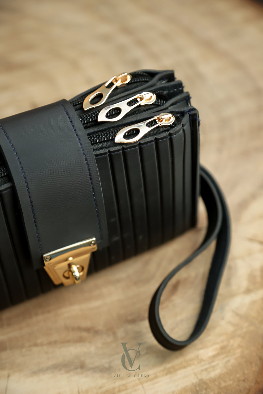 Triple Zipper Noir Clutch